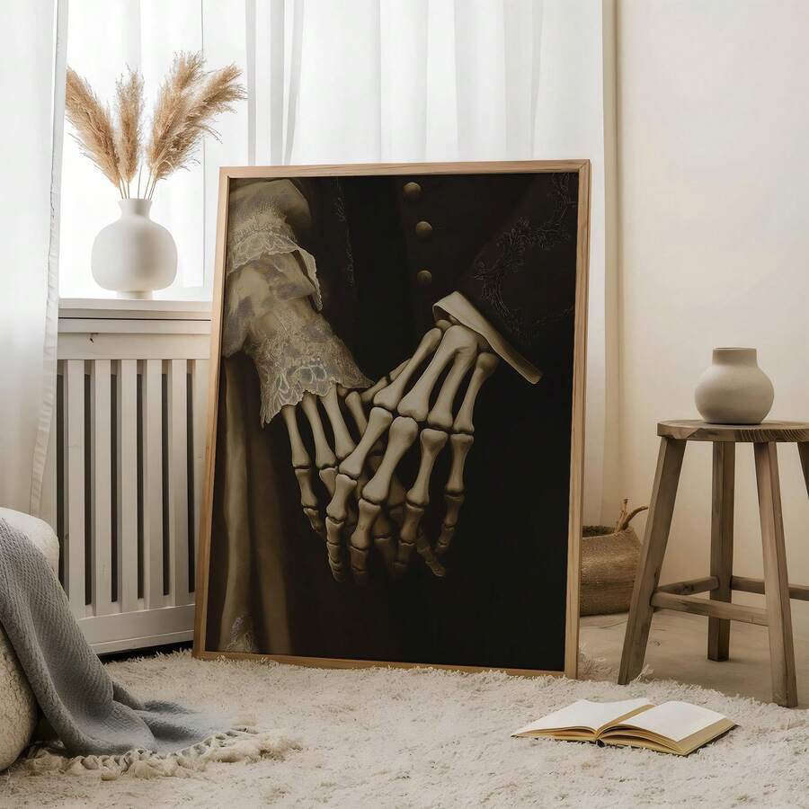 Two gothic skeletal hands holding in a gold-framed romantic wall art room mockup
