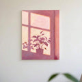 Blush pink potted plant window print hung on plain white wall