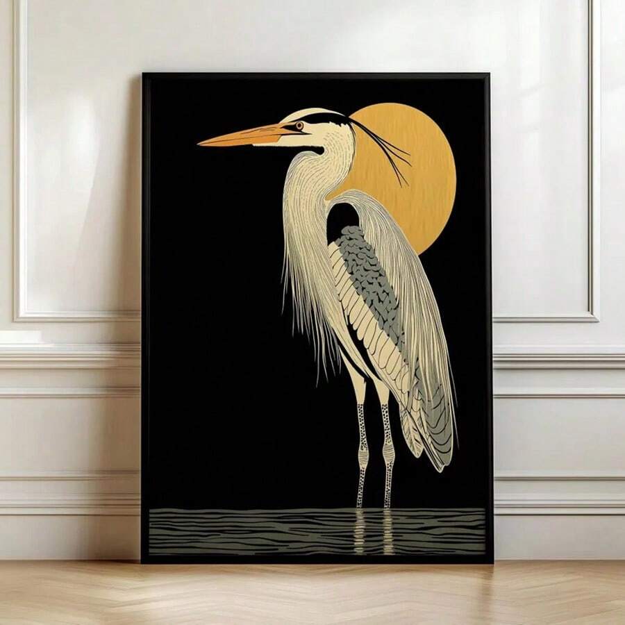 Black framed heron and gold sun wall art against white paneled wall