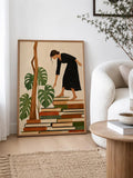 Vintage literary canvas art in a white frame near stacked books