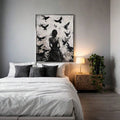 Dark academia raven wall art above bedroom bed