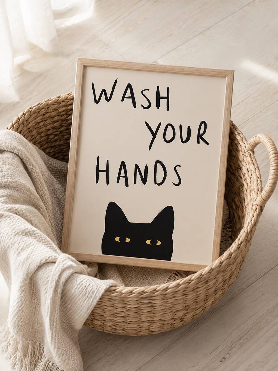 Minimalist black cat reminder on canvas above pale wood furniture and vase