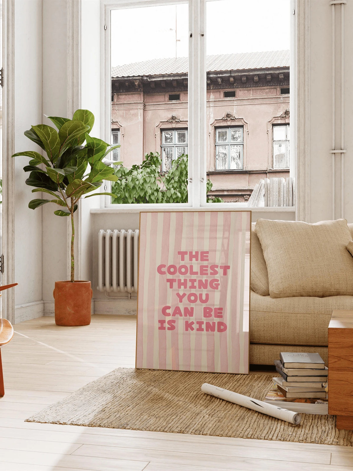 Pink striped kindness poster displayed in a living room