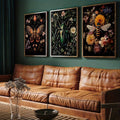 front framed view of Dark botanical insect wall art set showing bee, moth, butterfly and green beetle with flowers on black backgrounds in vintage specimen style.