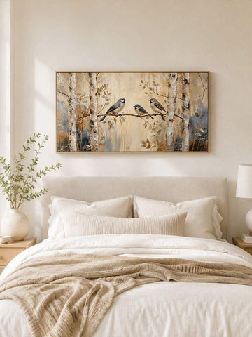 front framed view of Rustic nature canvas wall art showing three birds on a branch, birch trees, woodland foliage, warm beige neutrals and soft painterly cottage style.