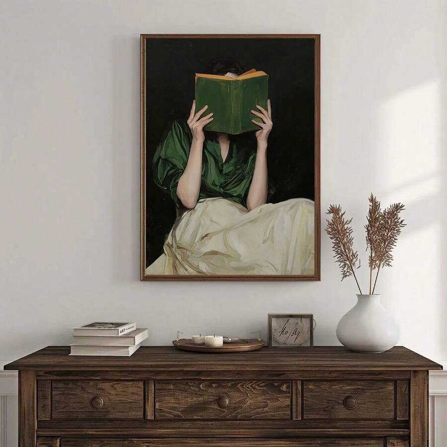 Woman reading book canvas above rustic dresser