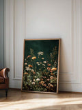 Dark floral print showing cream peach yellow and pink garden flowers on forest green