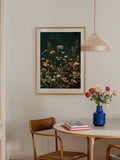 Matted framed botanical wildflower print above dining table with pendant light and blue vase