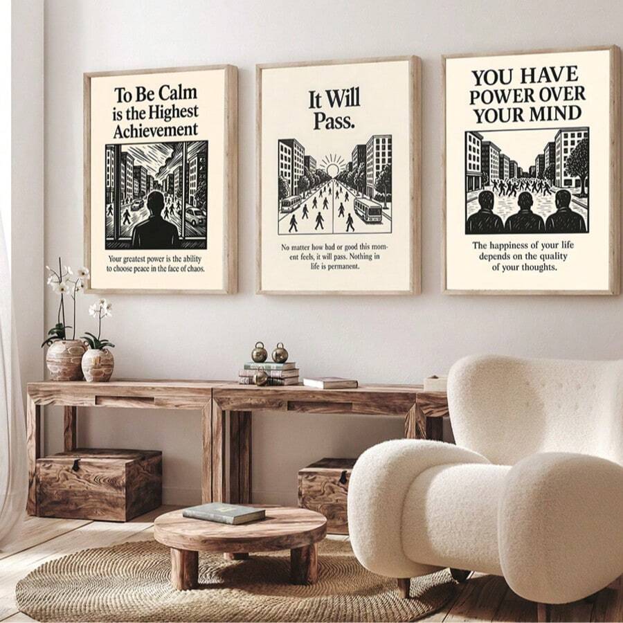 Motivational quote wall art triptych in light wood frames above rustic console table and cream lounge chair