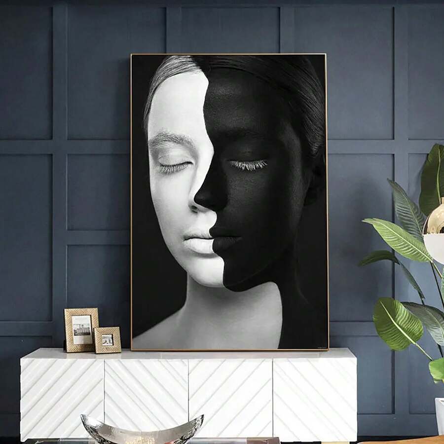 Gold-framed woman portrait canvas print on a navy accent wall above a white credenza