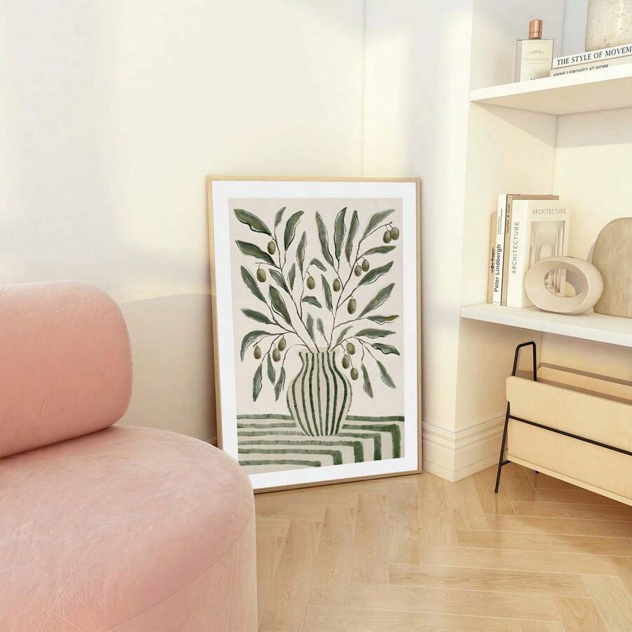 Framed green olive branch vase botanical print on white cabinet with neutral shelf decor