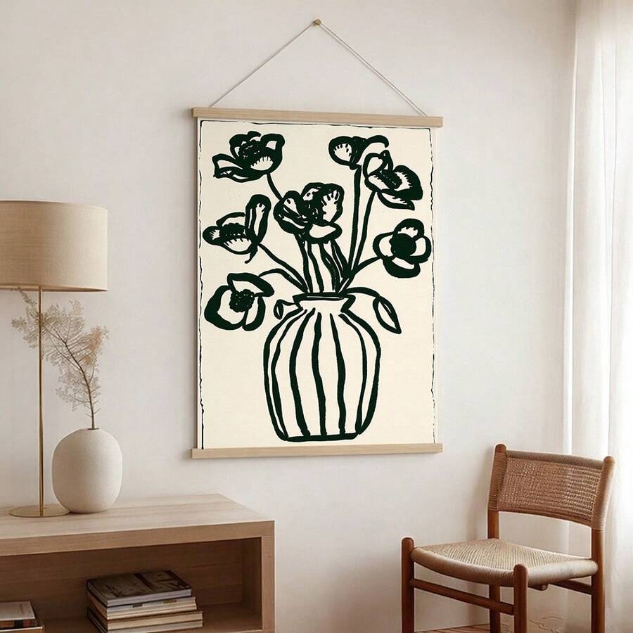 Dark green flower vase hanging poster with wood rails on neutral wall near chair