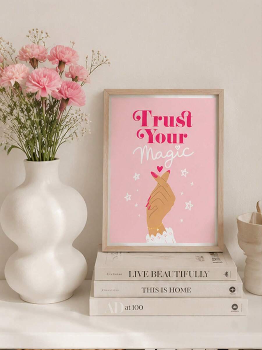 Trust Your Magic pink hand illustration print on a styled shelf