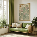 Sage green Japanese landscape wall art above a blue living room sofa