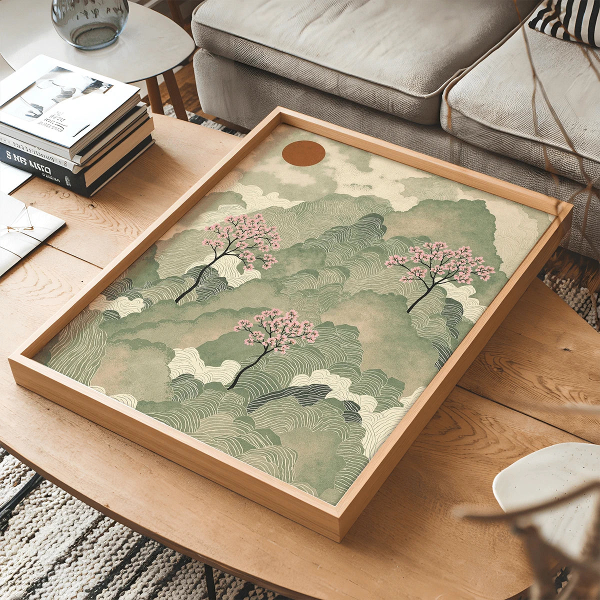 Japanese watercolor landscape wall art displayed in a wood tray frame above sofa