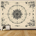 Lunar floral wall hanging displayed above sofa in neutral boho living room