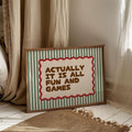 Striped fun and games wall art displayed in a bright room with soft curtains