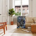Frameless big cat floral canvas print leaning below a window in a bright living room