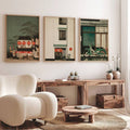 Japanese architectural triptych above a rustic wood console and cream chair