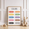 front framed view of Educational kids wall art showing a COLORS learning chart with labeled crayon icons in red, orange, yellow, green, blue, purple, pink, brown, black and gray.