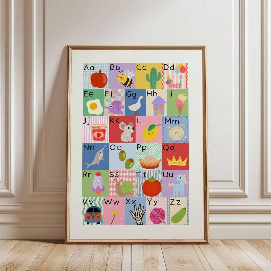 Alphabet wall art framed nursery poster leaning on floor with pastel A to Z illustrations