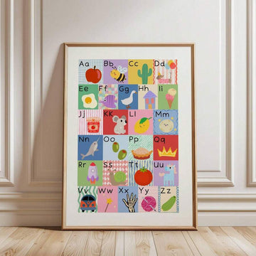 Alphabet wall art framed nursery poster leaning on floor with pastel A to Z illustrations
