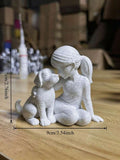 Size graphic showing girl and dog ornament about 9 cm wide and 7 cm tall.