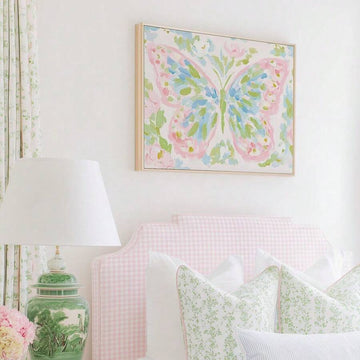 Framed pink blue butterfly wall art with soft floral background and white frame