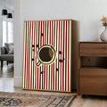 Framed coffee cup and beans print with red stripes near wood cabinet