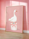 Funny bathroom wall decor with cute white goose standing on toilet paper