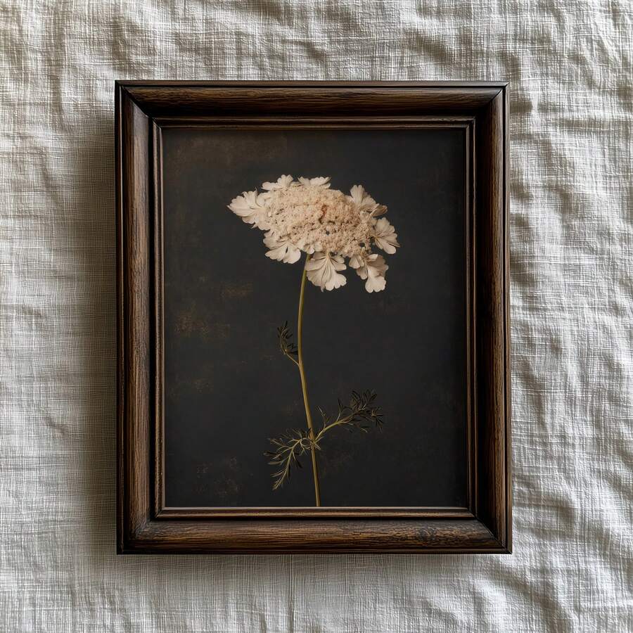 Dark floral wall art on mantel with white wildflower charcoal background books and candles