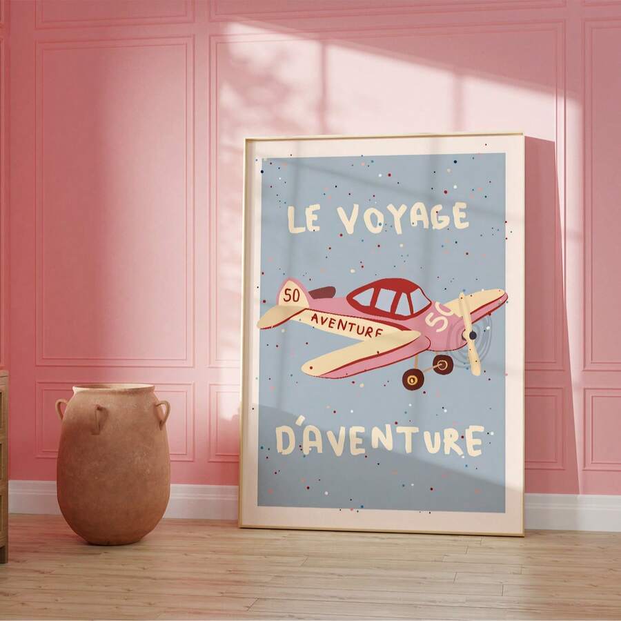 Vintage airplane poster in a blush pink paneled kids room with a small vase