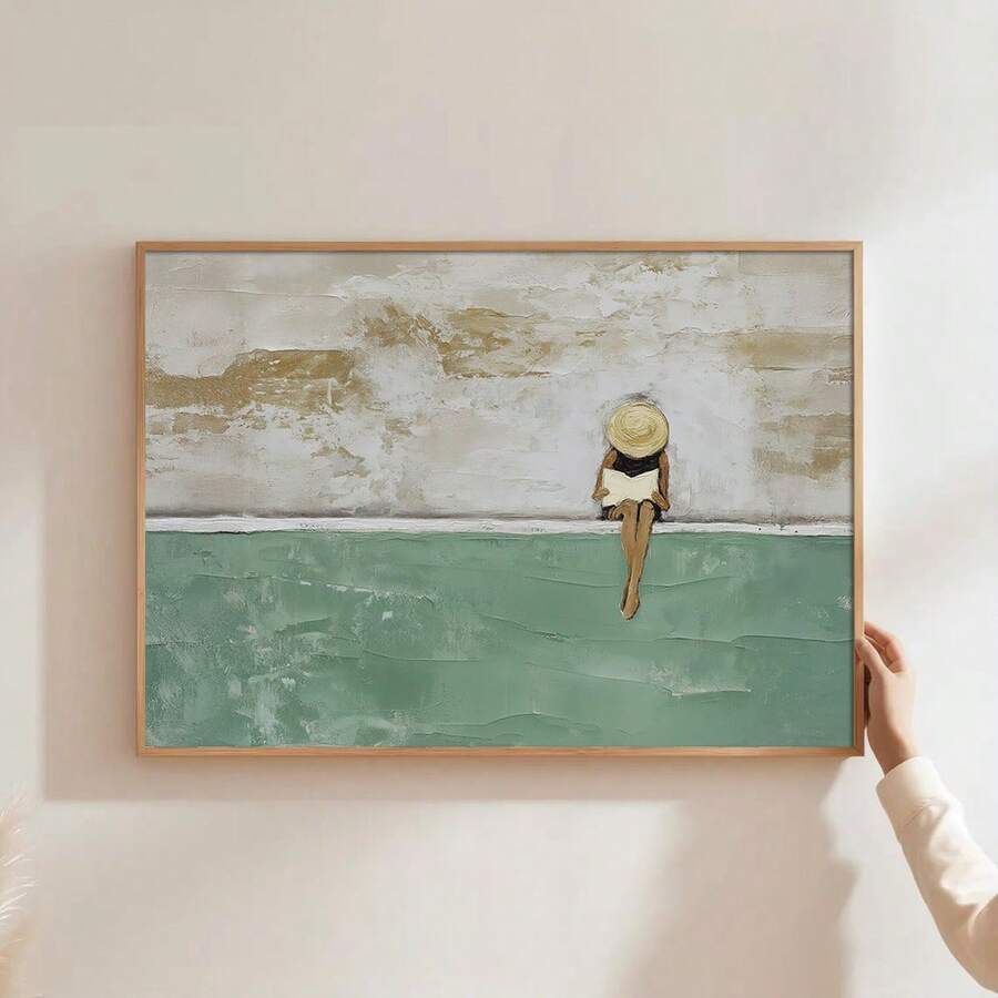 Coastal woman canvas wall art with wide brim hat beside turquoise water