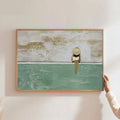 Coastal woman canvas wall art with wide brim hat beside turquoise water