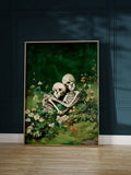 Framed skeleton lovers canvas with dark green background and antique gold frame