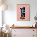 Framed canvas print of reader beside orange cat in pink and coral window facade