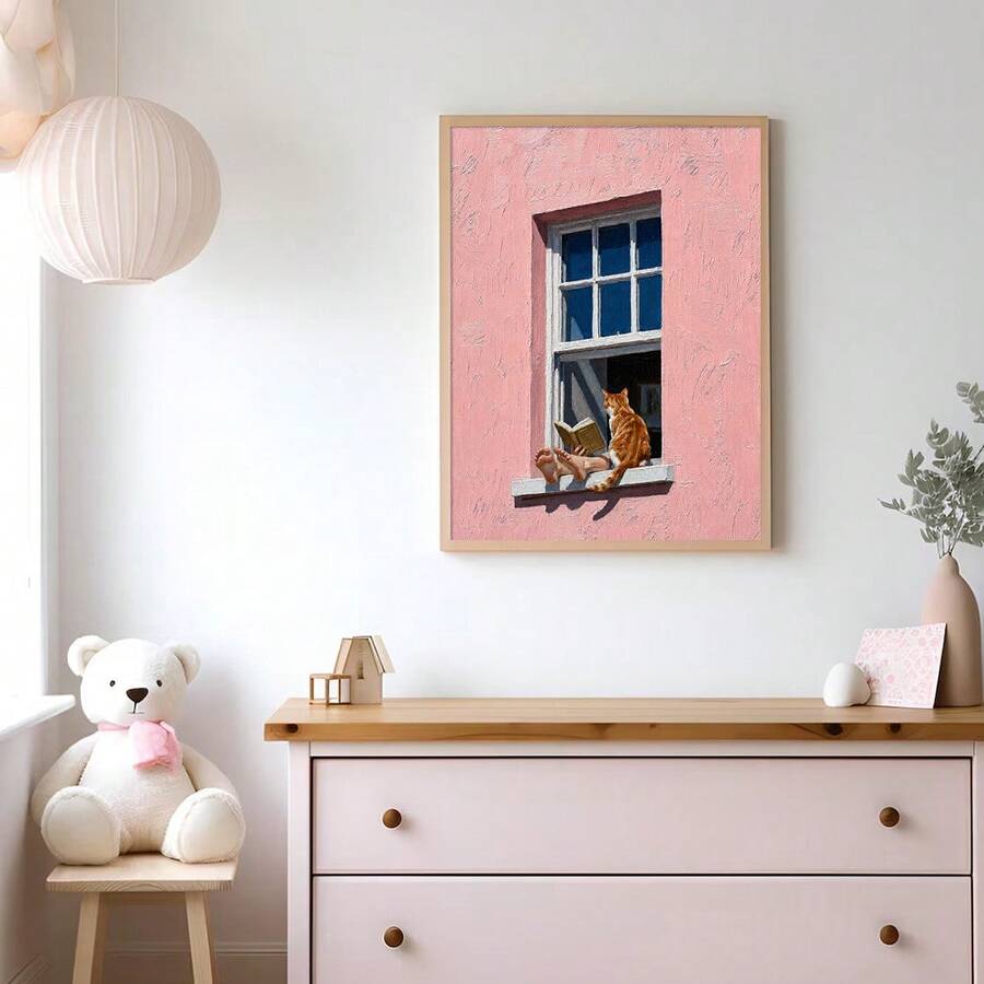 Framed canvas print of reader beside orange cat in pink and coral window facade