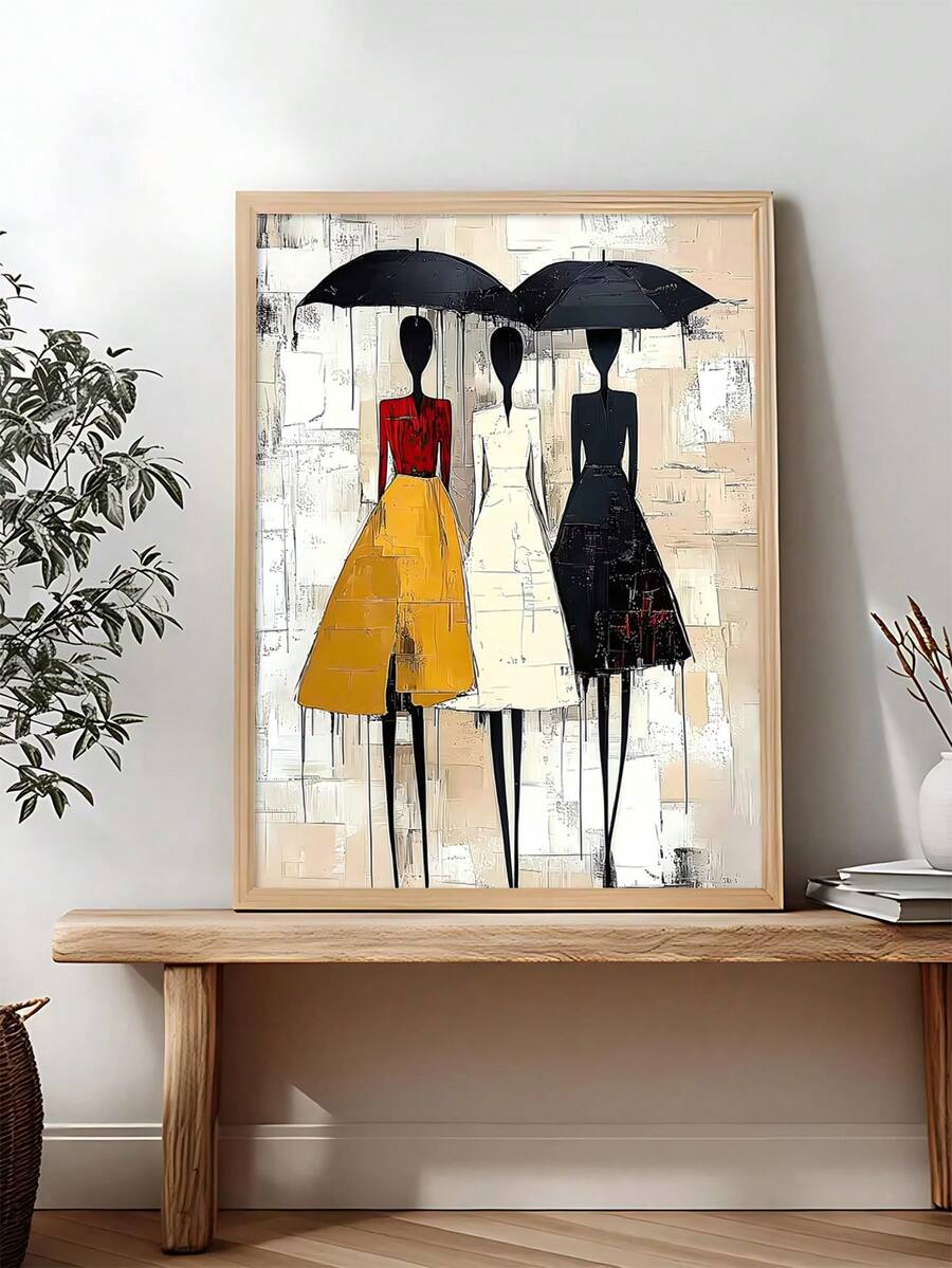 Three stylized women under black umbrellas in a wood-framed vertical fashion print on a console table