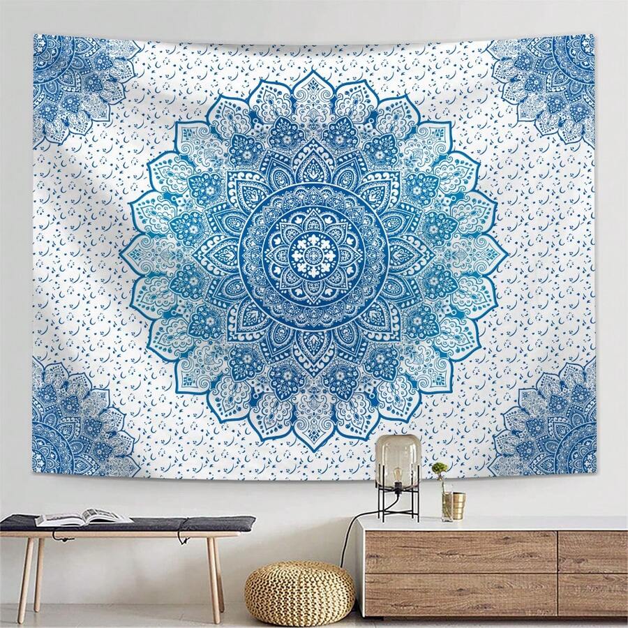 Mandala tapestry shown over sofa as blue white fabric wall art