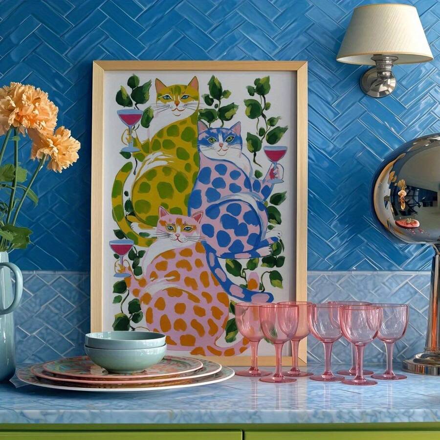Vintage colorful cat canvas wall art showing three spotted cats with wine glasses among green leafy vines