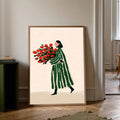 Framed illustration of woman in green striped coat carrying red flower bouquet on cream background