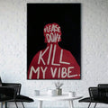Bold typography wall art displayed above a round table on a brick wall