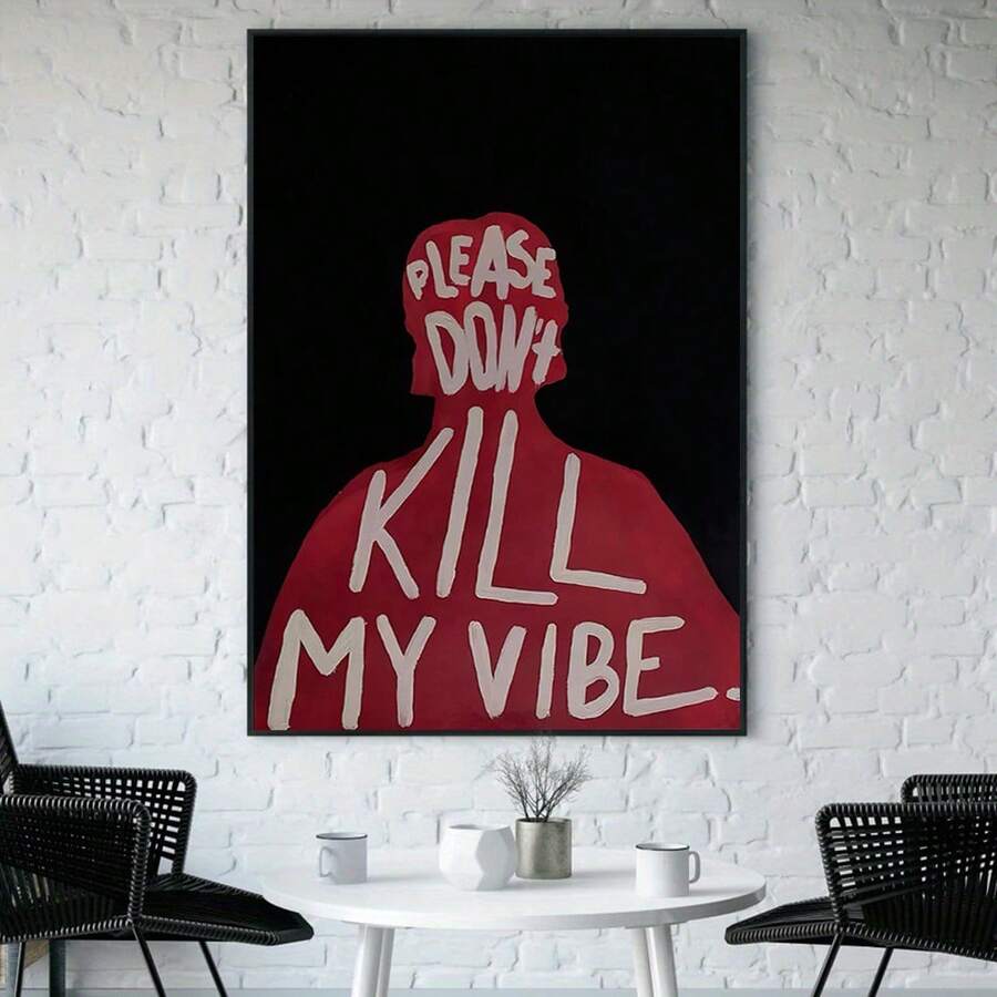 Bold typography wall art displayed above a round table on a brick wall
