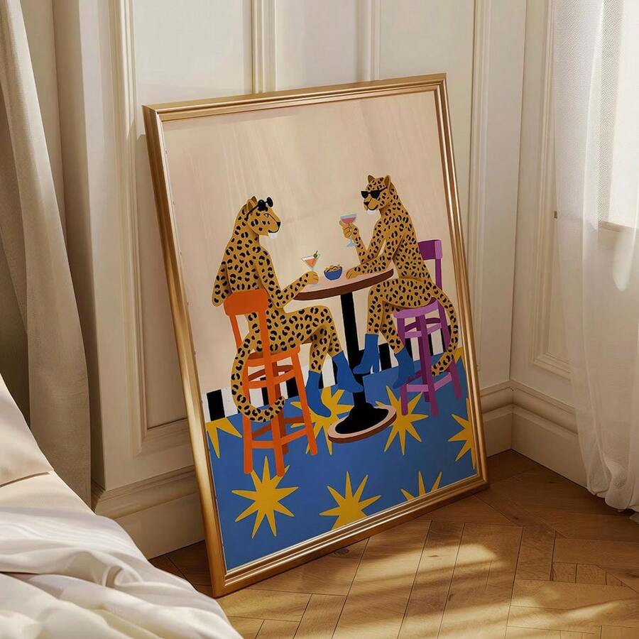 Whimsical wall art of two spotted big cats drinking cocktails at bar table