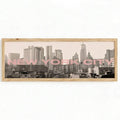 canvas option view of Panoramic framed wall art showing a black and white New York City skyline photo with blush pink NEW YORK CITY typography and modern travel poster style.