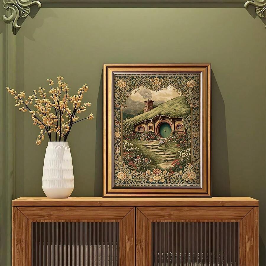 Framed cottagecore wall art with moss green tones and cozy garden scene