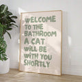 Framed cat lover bathroom wall art with humorous quote for powder room decor