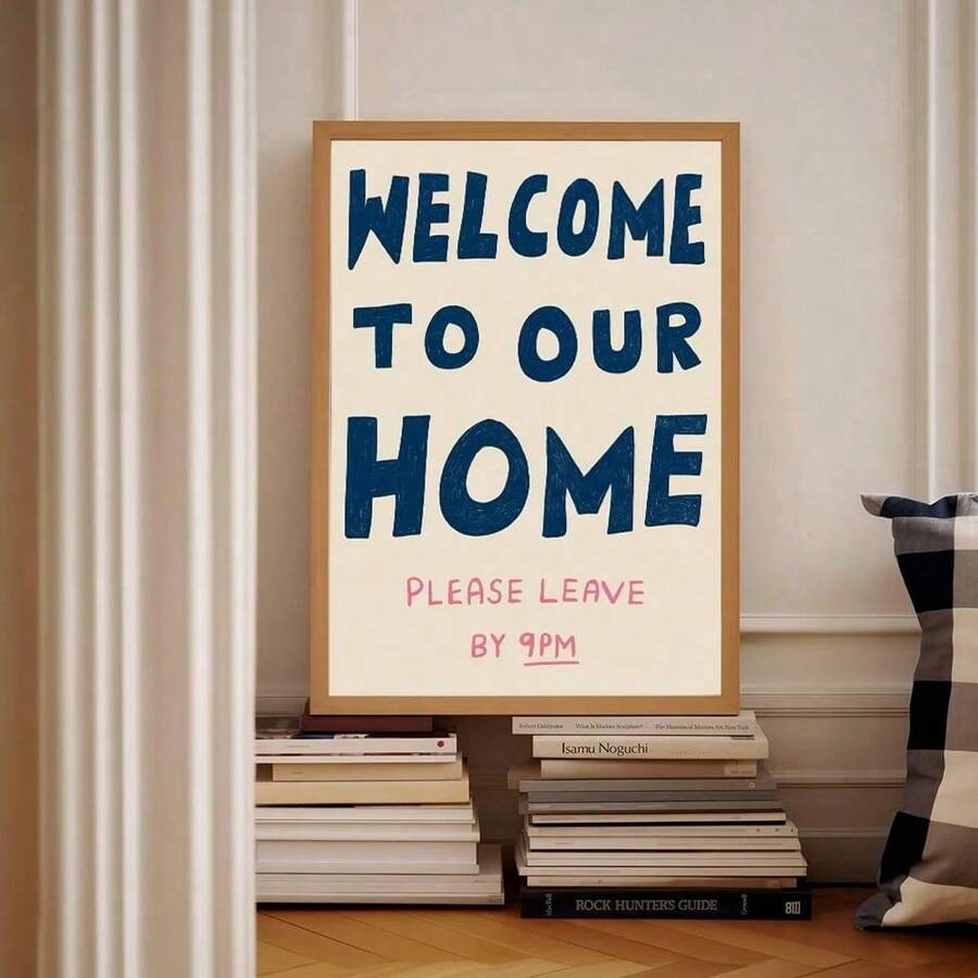 Welcome home please leave by 9 PM print displayed above a bed
