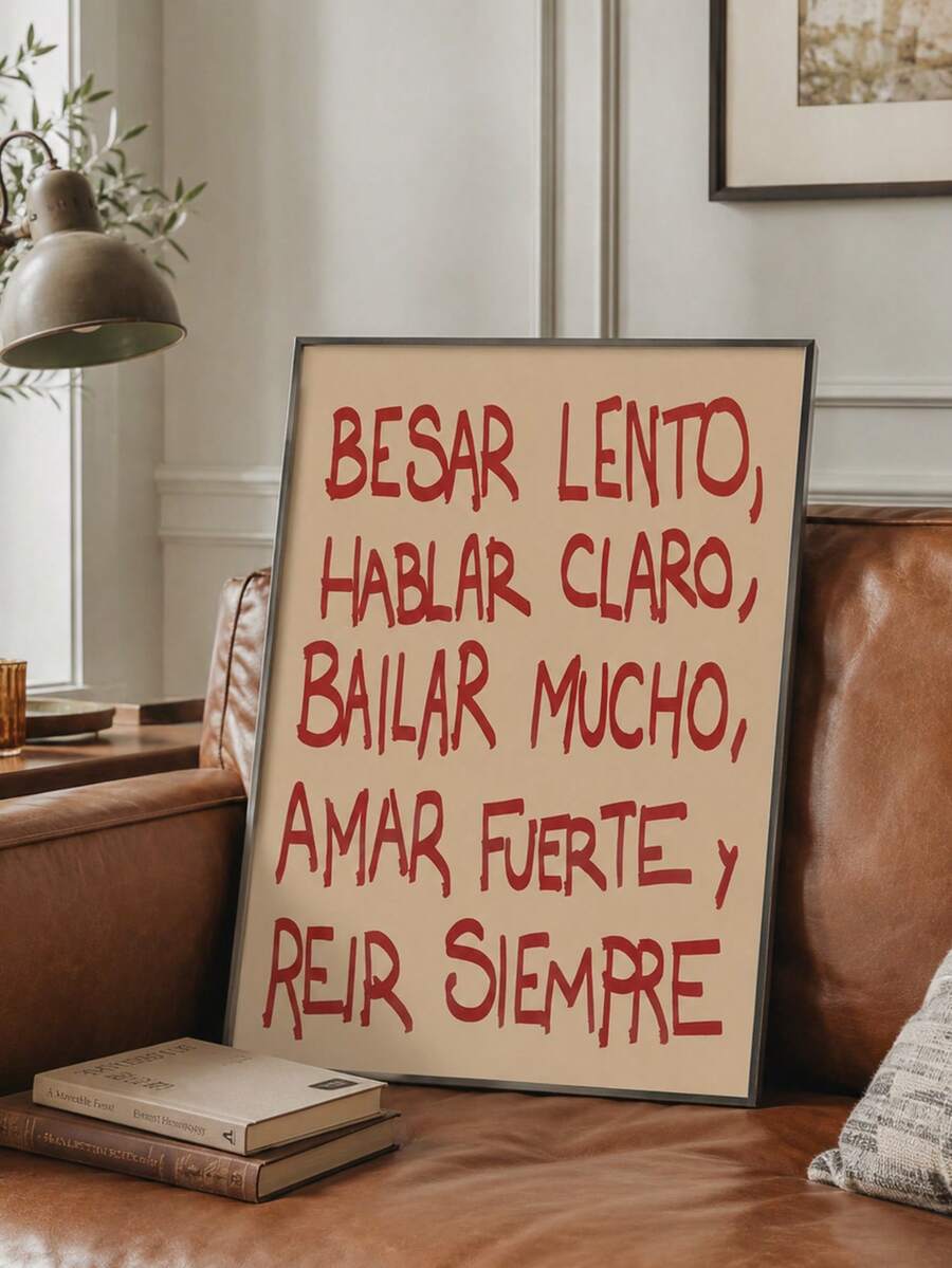 Cream canvas with red Spanish quote lettering shown beside a leather sofa