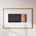 Anthony Bourdain quote poster with matchbox and red matches in wood frame